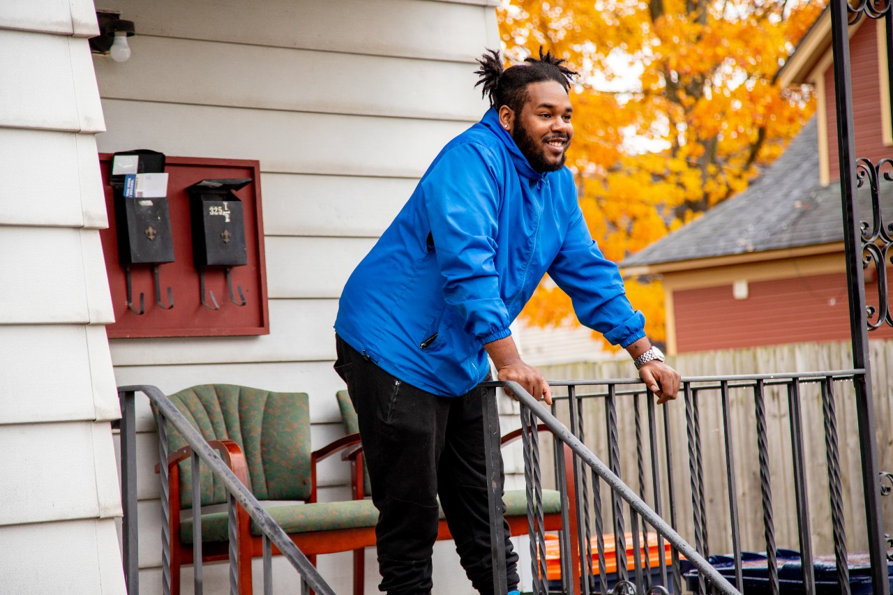 Man on Front Porch in the Fall